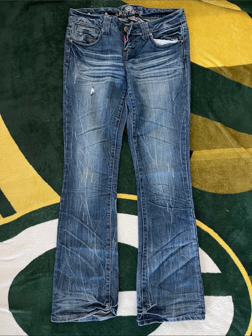 Almost Famous Mid Blue Flare Jeans with Subtle Distressing. Size 7